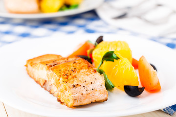 Salmon with oranges, tomatoes and olives