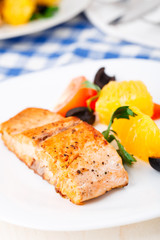 Salmon with oranges, tomatoes and olives