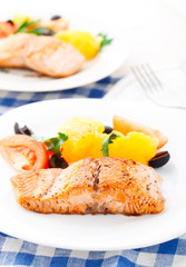 Salmon with oranges, tomatoes and olives