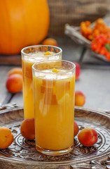 Orange drink on wooden table, selective focus