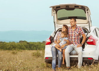 family in the mountains by car