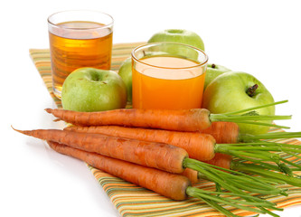 Glasses of juice, apples and carrots, isolated on white
