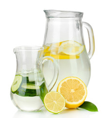 Cold water with lemon, cucumber and ice in pitchers isolated