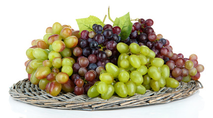 Fresh grape on wicker mat isolated on white
