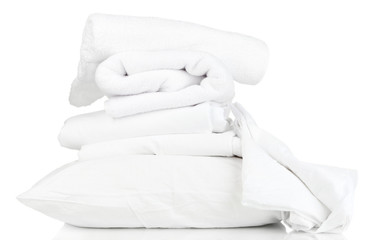 Stack of rumpled bedding sheets isolated on white