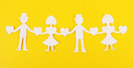 Paper people in social network concept on yellow background