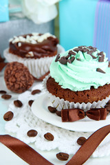 Tasty cupcake with gifts close up