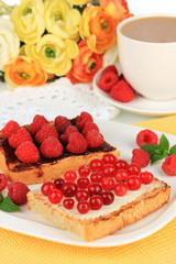 Delicious toast with berries on table close-up
