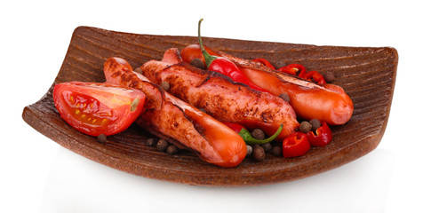 Delicious sausages on plate isolated on white