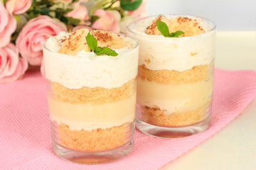 Delicious dessert with banana and caramel on table close-up