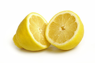 Two halves of lemon isolated on white