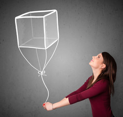 Woman holding a cube balloon