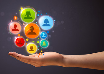 Social network icons in the hand of a woman