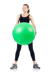 Woman exercising with swiss ball on white