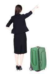 Back view of young brunette business woman traveling with suitca