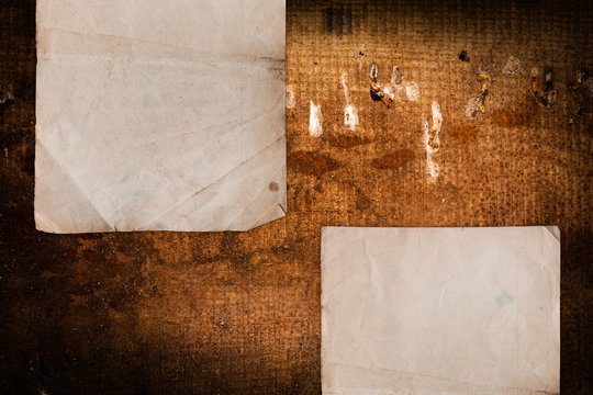 Damaged paper sheets on a vintage background