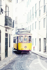 yellow ancient tram on streets of Lisbon, Portugal © Shchipkova Elena