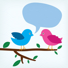 two birds with message bubble sitting on a tree branch