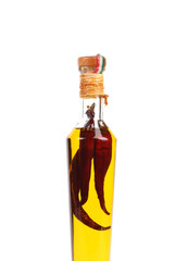 Red chillies preserved in bottle of oil.