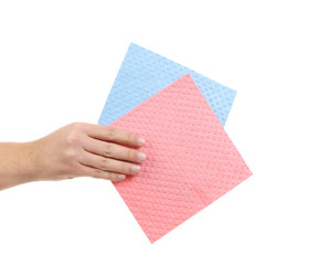 Hand holds two cleaning sponges.