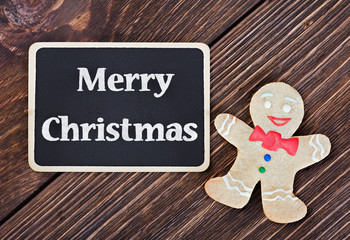baked Christmas cookies man and a blackboard
