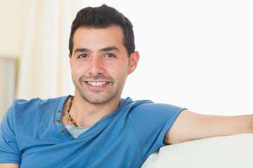 Casual good looking man relaxing on couch