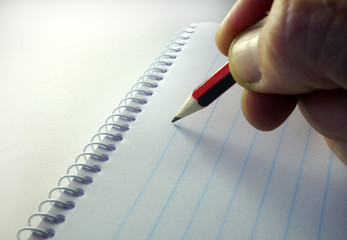 writing on a blank notepad