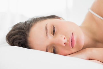 Obraz na płótnie Canvas Pretty young woman sleeping in bed
