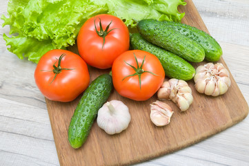 vegetables on a cutting board on a wooden table