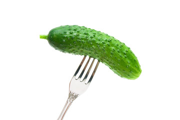 cucumber on a fork on a white background