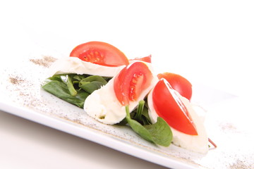 Caprese salad with spinach and rucola leaves