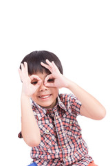 young boy peeking through hand