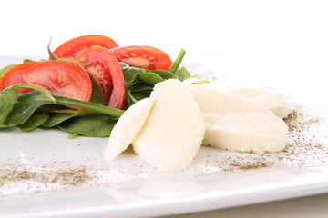 Caprese salad with spinach and rucola leaves
