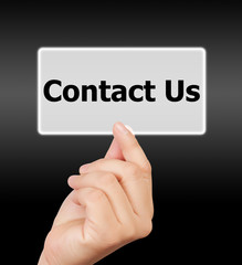man hand touching button contact us keyword.