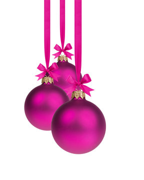 composition from three purple christmas balls hanging on ribbon