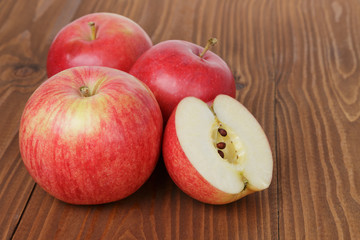 gala apples on wood table