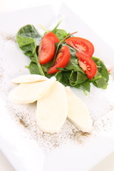 Caprese salad with spinach and rucola leaves