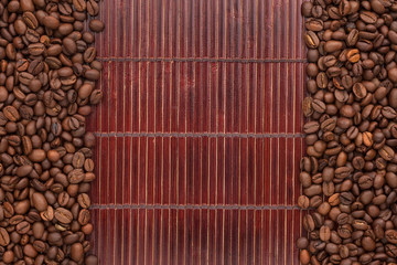 Coffee beans lying on a bamboo mat