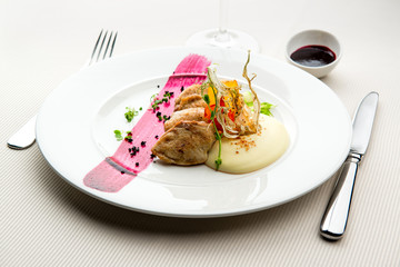 Fillet of duck breast served with salad and potato puree