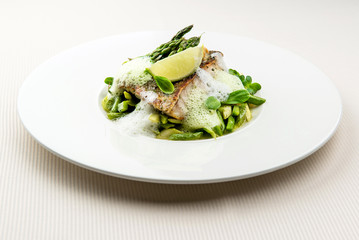 Sea bass fillet with asparagus infused with sauce foam