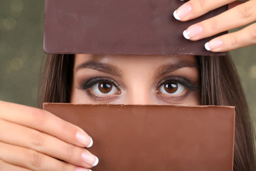 Portrait of beautiful young girl with chocolate