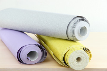 Wallpapers on wooden table in room