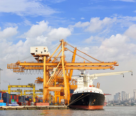 Cargo ship at the port with blue sky