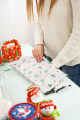 Woman Packing Christmas Gifts