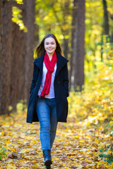 Teenage girl walking in city park