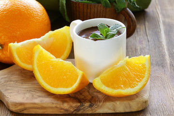 dessert of chocolate mousse (melted chocolate) with orange