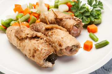 Beef rolls and vegetables