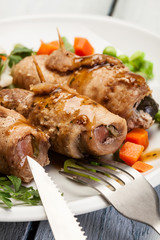 Beef rolls and vegetables