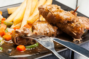 Beef rolls on fork