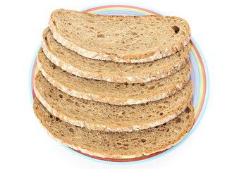 Slices of rye bread and colorful plate